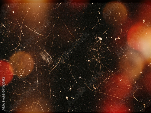 Vintage film texture with light leaks, scratches and bokeh on dark background