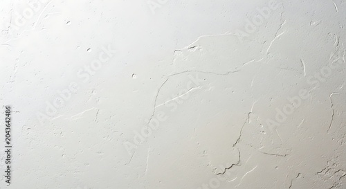 White textured concrete wall background with rough surface and subtle cracks