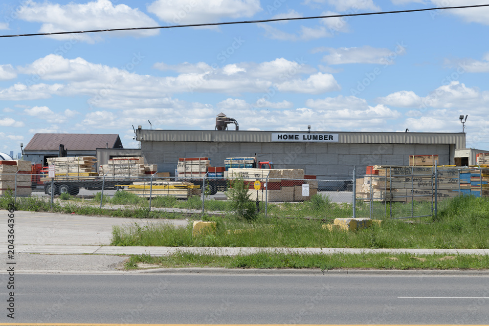 Naklejka premium wide view of lumber yard at Home Lumber Inc, a lumber store, located at 714 Birchmount Rd, Scarborough, Toronto