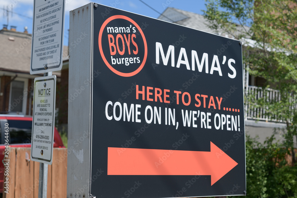 Obraz premium sign near Mama's Boys Burgers, a restaurant, located at 480 Danforth Rd, near Birchmount Rd, Toronto