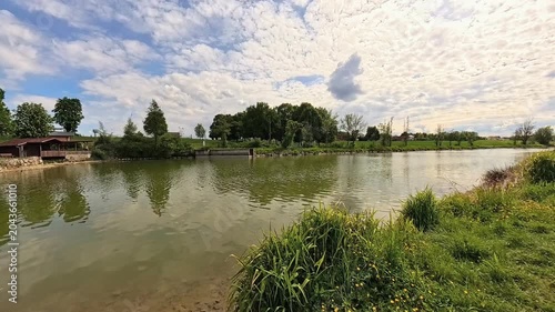 4K Timelapse video with moving clouds at Unteriglbach reservoir, Ortenburg, Passau, Bavaria, Germany