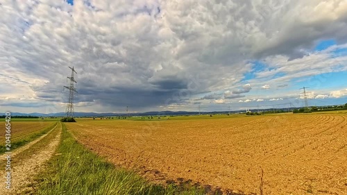 4K Timelapse video with moving clouds and a church near Wallerdorf, Kuenzing, Deggendorf, Bavaria, Germany