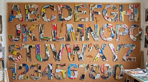Collage Alphabet Letters on Corkboard in Art Studio