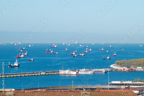 an horizontal photo view of the port area in the marmara region with many cargo ships at the sea