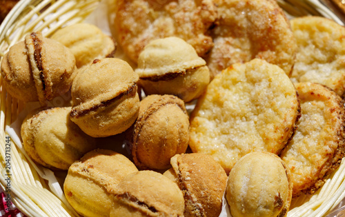 Baked goods in a basket at a local market during the afternoon