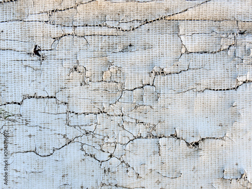 ragged and tattered plastic tarpaulin sheet with ripped and hole, torn white vinyl, abstract distressed background
