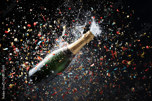 Champagne bottle bursts open with confetti, perfect for celebrations and festive occasions, capturing joy and excitement for your projects