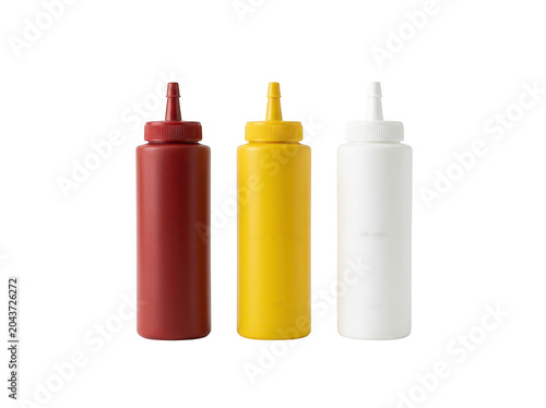 Three plastic squeeze bottles for condiments like ketchup, mustard, and mayonnaise isolated on transparent background
