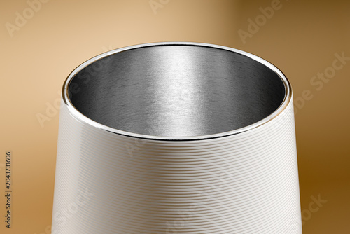 Vacuum Insulated Stainless Steel Tumbler with Brushed Aluminum Finish and Clear Acrylic Lid on Gold Background