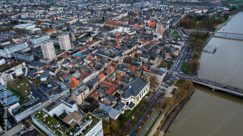 Obraz premium An panoramic aerial view of the old town city Thionville in France on a cloudy noon in autumn.. 