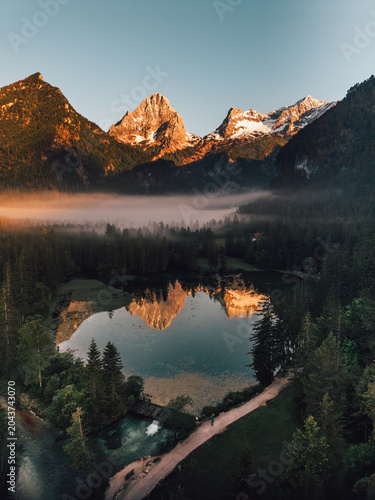 Schiederweiher lake with mountain reflections at sunrise in Upper Austria, Austria