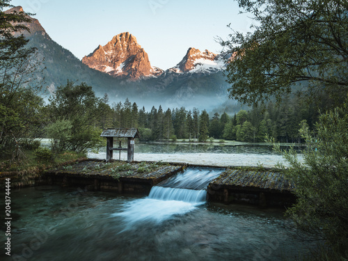 Schiederweiher lake with mountain reflections at sunrise in Upper Austria, Austria
