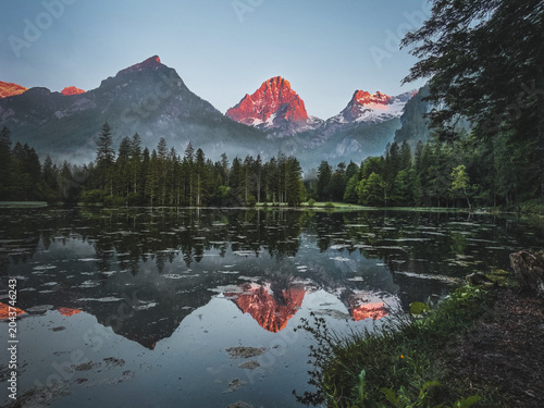 Schiederweiher lake with mountain reflections at sunrise in Upper Austria, Austria