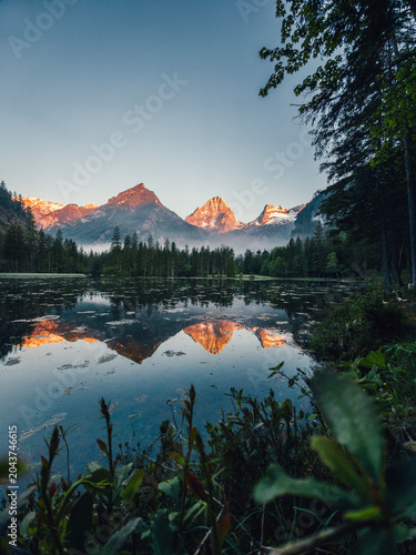 Schiederweiher lake with mountain reflections at sunrise in Upper Austria, Austria