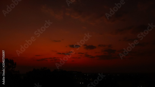 time lapse sunset, Dark red night sky background, silhouette of trees, nature photography