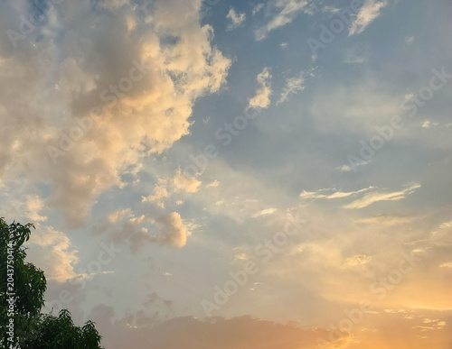 sunset in the cloudy sky, sunlight through clouds background, nature photography, natural wallpaper 