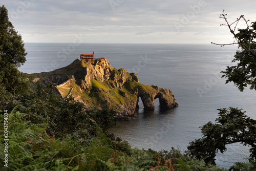 The San Juan de Gaztelugatxe Natural Monument is located on the Basque coast, between the municipalities of Bakio and Bermeo, at dawn