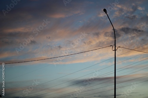Lantern against the backdrop of a beautiful evening sky cityscape city sunset