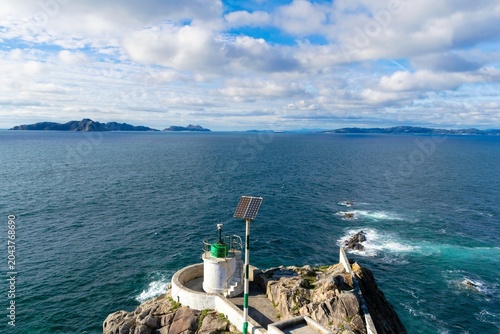 Monteferro lighthouse with Cies Islands in the background, Nigran, Galicia, Spain.