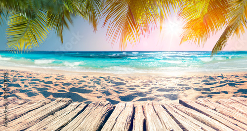 Palm Beach At Sunset With Defocused Background - Summer Vacation - Table And Sand With Blue Ocean - Abstract Blurred Lights - Glittering Effects