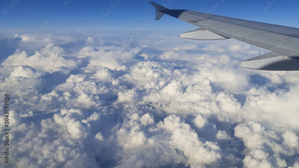 Fototapeta premium clouds seen from the sky while flying in an airplane