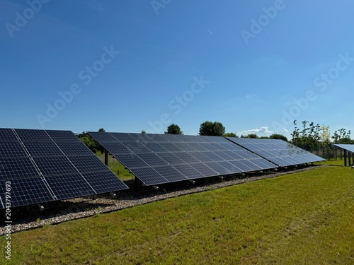 Modern Solar Power Plant on a Green Field, Renewable Clean Energy Production