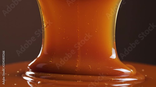 Caramel sauce flow, abstract background
