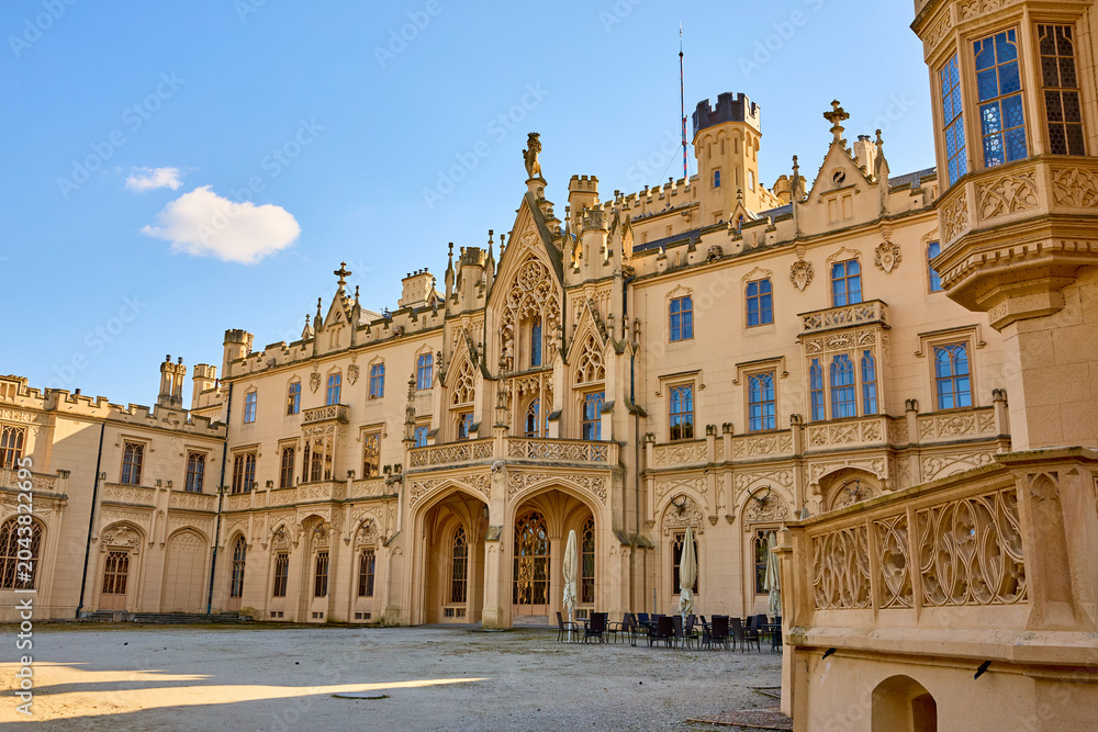 Fototapeta premium Exquisite gothic revival castle with ornate architecture and majestic facade