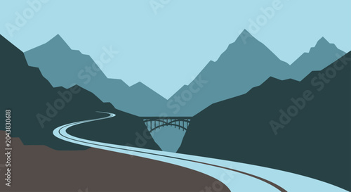 A winding road curves through a valley with a bridge over a canyon and mountains