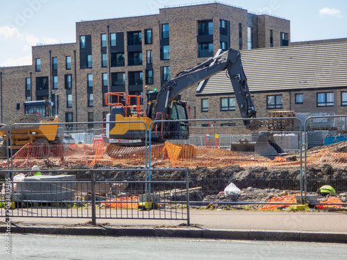 Tableau sur toile A residential construction site in Scotland, A modern brick apartment building in the background