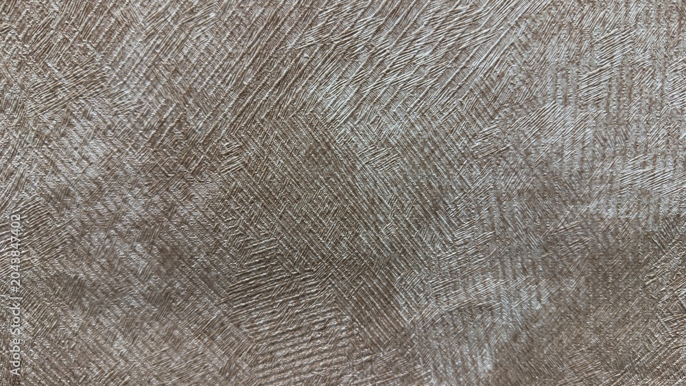 Obraz premium Abstract champagne gold metallic texture with brushed embossed plaster pattern and shimmering surface