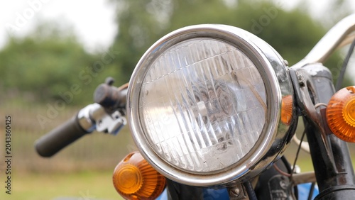 Schilderij op canvas Vintage motorcycle headlight with chrome bezel and clear patterned glass positio