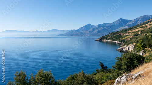 View of the sea and mountains from a scenic coastal vantage point, travel landscape concept, with copy space
