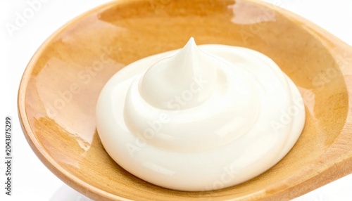 Creamy white yogurt swirl on a polished wooden spoon, perfect for culinary lifestyle, dairy dessert, healthy food photography, beauty skincare texture