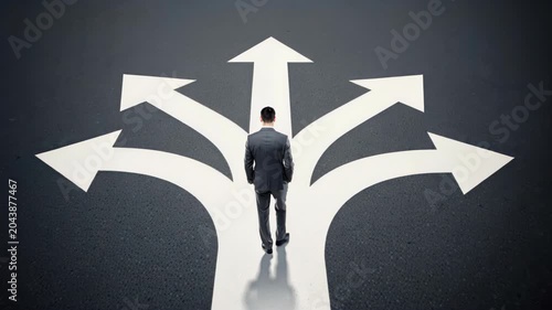 Decision Crossroads: A solitary businessman stands at a diverging path, illuminated by stark white arrows pointing in multiple directions, symbolizing choice and the uncertainty of the future.