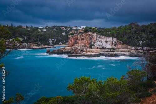 Cala Llombards, rocky south coast of Mallorca island, Spain. View from Mirador del Pontas at dusk. November 2026
