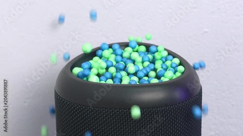 Sound frequency visualization concept with green and blue balls jumping from a loud bass speaker