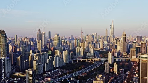 Shanghai skyline with modern skyscrapers and elevated highway at sunset in Shanghai, China