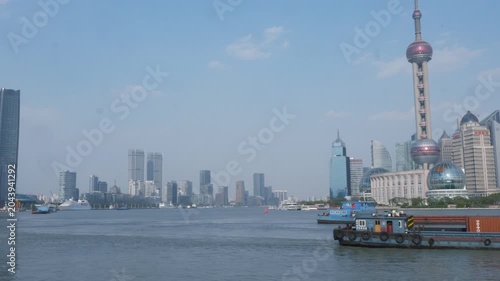 Shanghai Skyline with Oriental Pearl Tower and Barge on Huangpu River in Shanghai, China