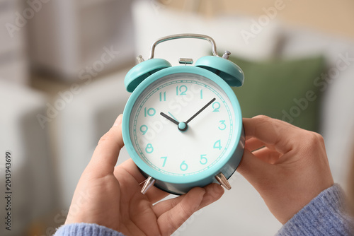 Hands holding blue retro al...