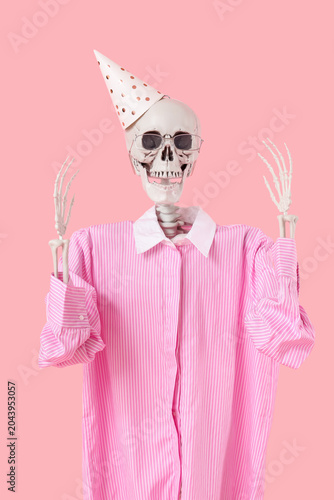 Human skeleton in party hat...