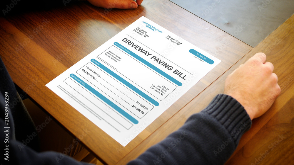 Fototapeta premium A Stressed Out Homeowner Looks at Generic Driveway Pavement Bill
