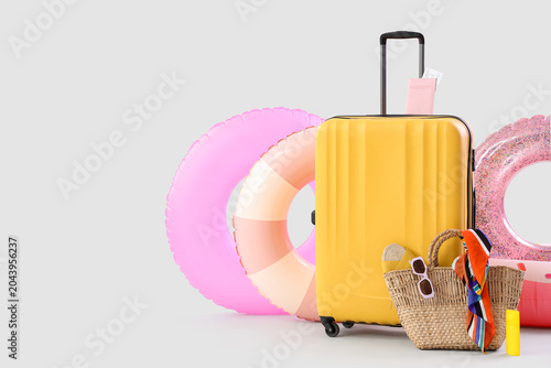 Suitcase, inflatable rings ...