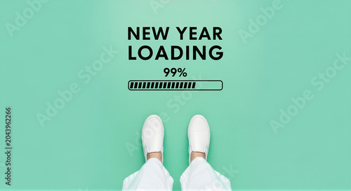 New year loading concept with a progress bar and a persons feet in white sneakers on a light green background