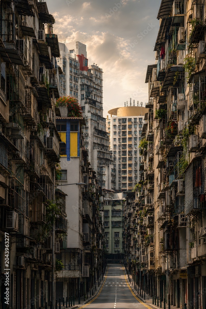 Fototapeta premium Narrow Urban Alley Between Apartment Buildings