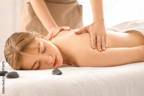 Young woman undergoing mass...