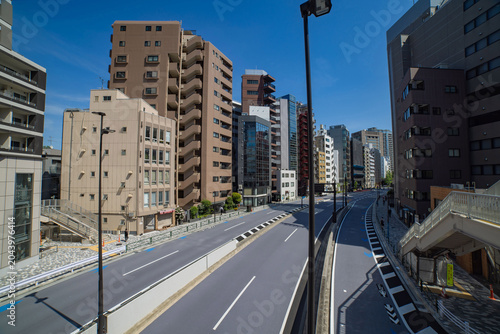 A cityscape of traffic jam at the city street in the business town wide shot