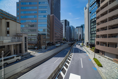 A cityscape of traffic jam at the city street in the business town wide shot