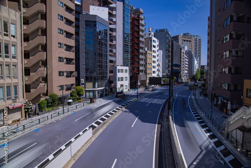 A cityscape of traffic jam at the city street in the business town wide shot