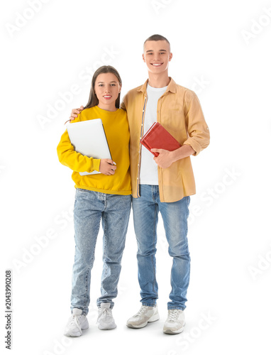 Happy students with books a...